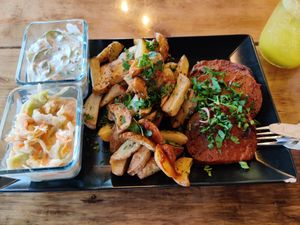 'Tradyszyn' - seitan stake, baked potatoes, cabbage salad and cucumber salad at Caffe Miasto in Warsaw