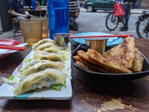 Dumplings and sesame pancake at Spicy Moon - 6th St in New York City