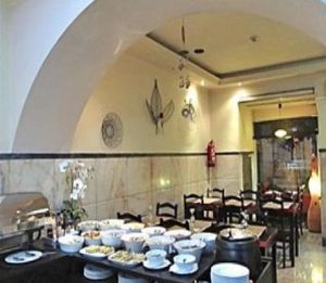 Bountiful buffet with a colorful array of salads, veggies, indian fritters and poppadom on a quiet, rainy Sunday night in Lisbon. at Jardim das Cerejas - Chiado in Lisbon