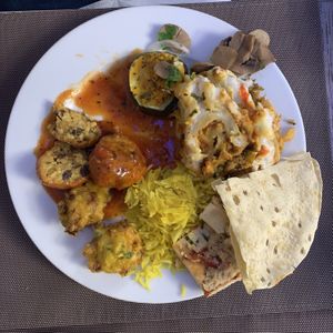 A mix of dishes from the buffet, including lasagna and meatballs  at Jardim das Cerejas - Chiado in Lisbon