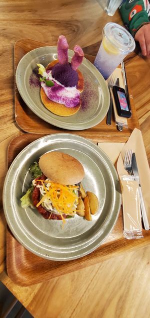 DELICIOUS. Pancakes with sweet potato. Whole grain burger. I didn't have room for the soft serve. at Rakuen Cafe in Naha