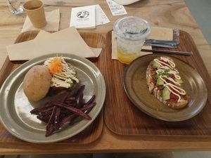 Was mega hungry so I got both the burger set (comes with the bevvie) which was delightful & the taco avocado toast dealie - not bad. at Rakuen Cafe in Naha