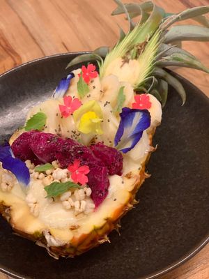 Smoothie in a pineapple shell with cut fruits on top. Cold and refreshing.  at Rakuen Cafe in Naha