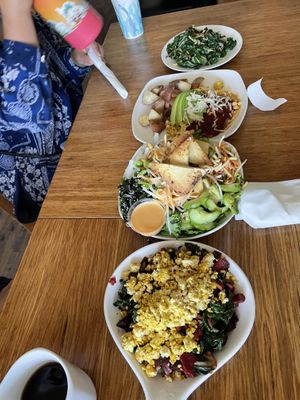 Bottom to top: veggie hash, Vietnamese noodle bowl, huevos rancheros, and a side of greens  at Palm Greens Cafe in Palm Springs