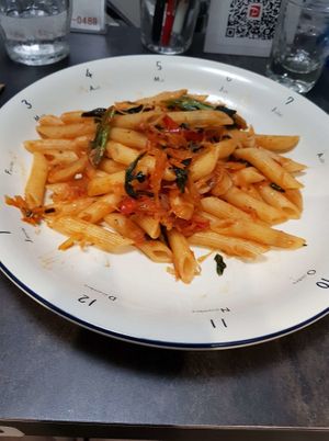 Delicious Vegan Homemade Penne Pasta with 'shredded papaya mixed with tomato' sauce, olives, mushrooms and Madagascar pink peppercorns! at Strada Alla Vista in Naha