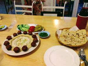 Felafel, hummus, baba ganoush, pickles, salad, and Yemeni chilli at Sababa in Chiang Mai