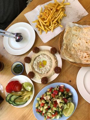 Hummus, baba ganoush, pickles, falafel, salad, flatbread, fries at Sababa in Chiang Mai