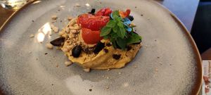 Hummus and dried tomatoes, zaatar, olives, dried tomatoes, pine nuts, basil at Le Potager de Charlotte - Rennequin in Paris