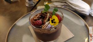 Strawberry : vanilla cashcrew cream, rhubarb and blueberry coulis, granola, almond and buckwheat, lime zest. at Le Potager de Charlotte - Rennequin in Paris