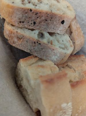 Two types of complimentary bread at Le Potager de Charlotte - Rennequin in Paris