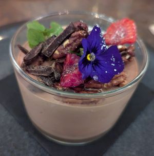 Chocolate Mousse dessert (raspberries, caramelised pecans and chocolate flakes at Le Potager de Charlotte - Rennequin in Paris