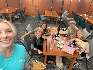 With friends and our server. Outside out back. Also outside seating in front of restaurant available  at Wally's in Surf City