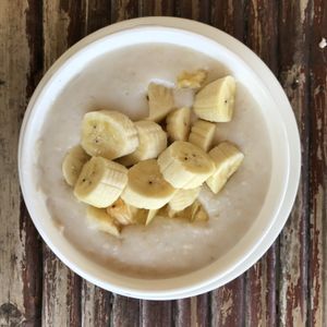 Yummy breakfast: porridge cooked with water and coconut milk plus banana and pineapple.  at Som‘s Seafood in Koh Phangan
