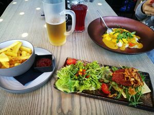 Tex-Mex burger and Alpencurry. Fries ordered separately. at Tom Almhütte in Maria Alm