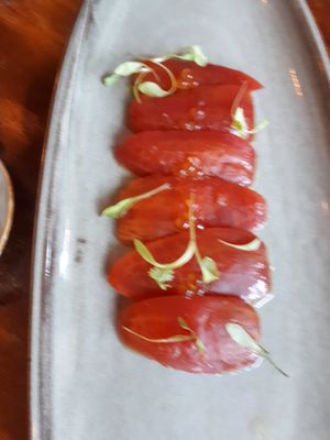 Tomatie sashimi with wasabi pearls at Coco Cuina Viva in Cadaques
