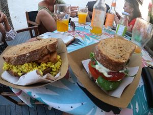 Tempeh scrambled tofu sandwich + cashew nuts cheese w/ pesto sandwich at Coco Cuina Viva in Cadaques