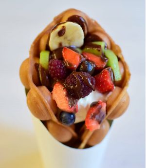 Bubble waffle with fresh berries/fruits and non dairy ice-cream.  at SIA Putni in Jelgava