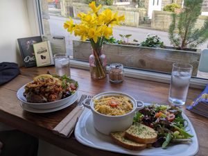 Vegan dishes and beautiful daffodils in January! at Pixie Bakes Cakery and Coffee Shop in Tintwistle