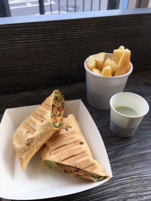 TLT (toasted): Tempeh, lettuce, tomato wrap, with avo, home made mayo and a side of cassava chips with cuban mojito sauce at Simple and Good in Enfield
