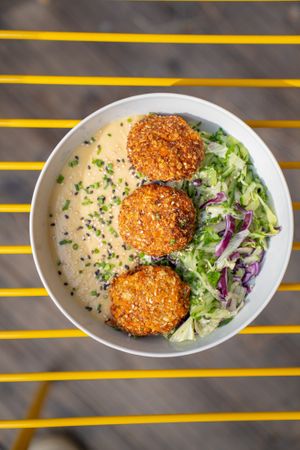 Home made patties with hummus and fresh veg at Made with Laf in Bratislava