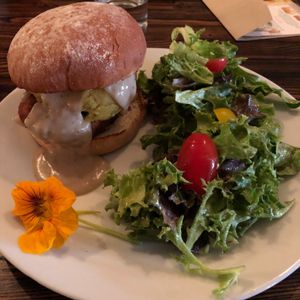 No-clucks fried "chicken" sandwich doused in gravy with a side of delicious mixed greens. The dressing...I can't even describe how perfect it was.  at Modern Shaman in Whittier