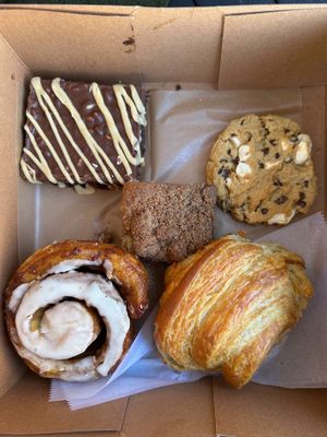 Peanut butter brownie, marshmallow peanut butter chocolate chip cookie, breakfast croissant, coffee cake, and cinnamon roll.  at Hazel & Jade Bakery in San Diego