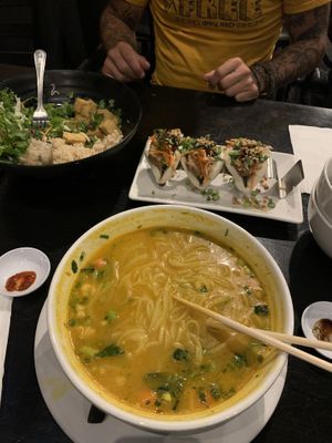 Yellow curry soup, vegan beef bao buns, build your own bowl with brown rice and salt and pepper tofu at Holy Basil Pho in Oakland