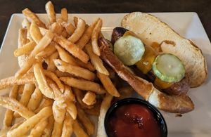 Beyond brat on pretzel bun (vegetarian). Fries are cooked in same oil as meat so that is a personal call for many. at South Gate Brewing Company in Oakhurst