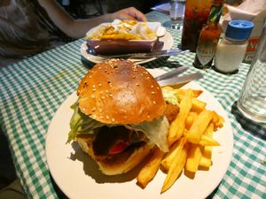 This is the "Chicken Burger", in the back the (wrong) Tofu Tacos at Coffee Temple in Varkala