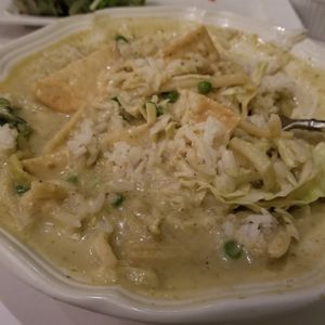 Super thick green curry with tofu. It has peas in it and lots of cabbage. HUGE portion.  at Blue Orchid in Lincoln