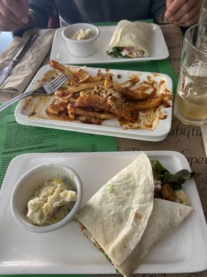 They split the dishes if you’re sharing! Greek Wrap with feta cheese and potato salad on the side at La Factoría Vegana in Leon