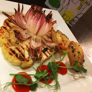 Cauliflower steak, courgette fritter, sriracha & roast red onion at Ilkley Moor Vaults in Ilkley