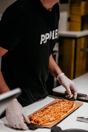 Pizza on counter at P.Pole Pizza in Coral Gables