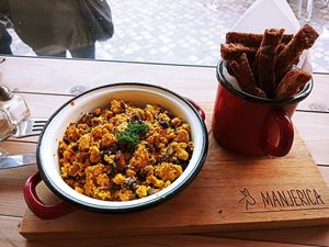 Scrambled tofu with homemade breadsticks at Manjerica in Lisbon