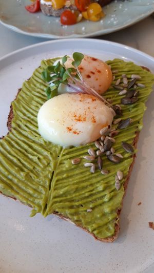 Avocado toast with eggs at Manjerica in Lisbon