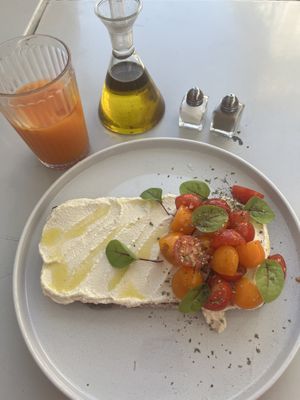 Vegan cashew nut cheese with cherry tomato - really light and savoury. I also had a carrot, orange and ginger juice which was good   at Manjerica in Lisbon