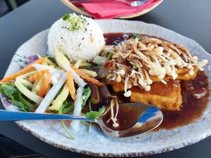 Ikone Enoki: tofu steak, enoki mushrooms, soy sauce, cilantro greens, jasmine rice (14.90) at Tam Tam in Dusseldorf