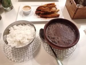 Beans and rice sides at Lo De Monik in Havana
