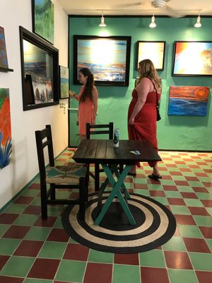 You can wander the art galleries with a drink while waiting for your food  at Qulture in Puerto Vallarta