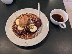 Acai bowl with peanut butter and a brew coffee at Pom & Flora in Stockholm