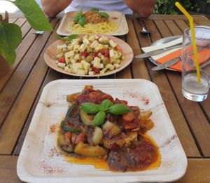 Seitan patties, salad with vegan cheese and spaghetti bolognese at Gostilna Pri Pošti in Ptuj