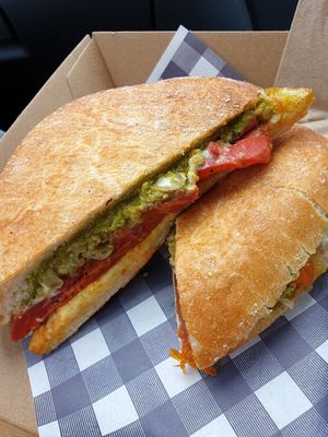 Toastie with pesto, capsicum and spicy vegan pepperoni at Little Mylkbar in Parkville
