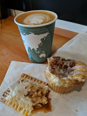 Lavender Latte with Soy milk as an option (🌱 Milk options:  Almond, Soy, or Hemp milk) and a Pop Tart (almondy flavor) and Coffee Crunch Muffin partially missing top. I forgot t at Tender Loving Coffee in Chico