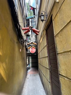 Entry alley at Hidden Gem Cafe in Hanoi