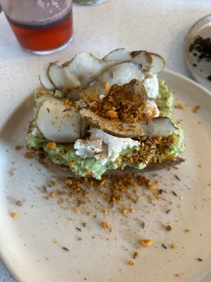 Avo toast (vegan) with macadamia ricotta  at Nola Kitchen in Porto
