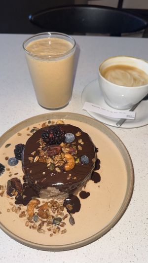 The peanut drink was the best! Coffee was good, vegan Pancakes were a 7/10. Something in the creamy sauce around didn‘t match to the rest… All in all nice experience.  at Nola Kitchen in Porto