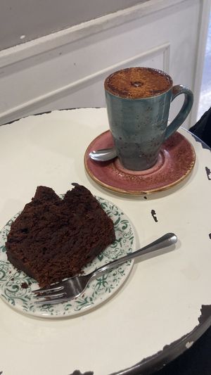 Vegan chocolate and avocado cake (perfect level of sweetness) and capuccino with oat milk   at Velvet Bakery in Vitoria Gasteiz