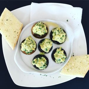 Spinach artichoke mushroom caps at Super Natural Vegan Cuisine in Lindsay