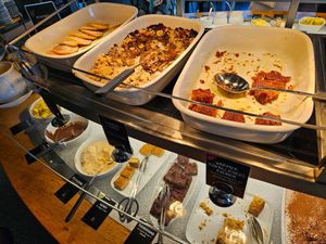 Dessert / sweet section: pancakes, rhubarb crumble, cakes, brownies, creams at Tibits in Darmstadt
