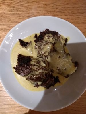 Chocolate brownie cake and vanilla custard- free as one of the dishes tasted burnt so as apologies we both could have desert. We sgared this and it was super tasty. at Tibits in Darmstadt